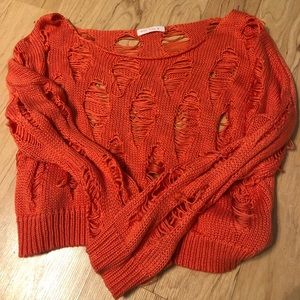 Distressed orange sweater